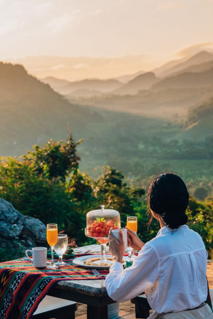 A guest having breakfast at the Cliff at The Rainforest Lodge at Sleeping Giant