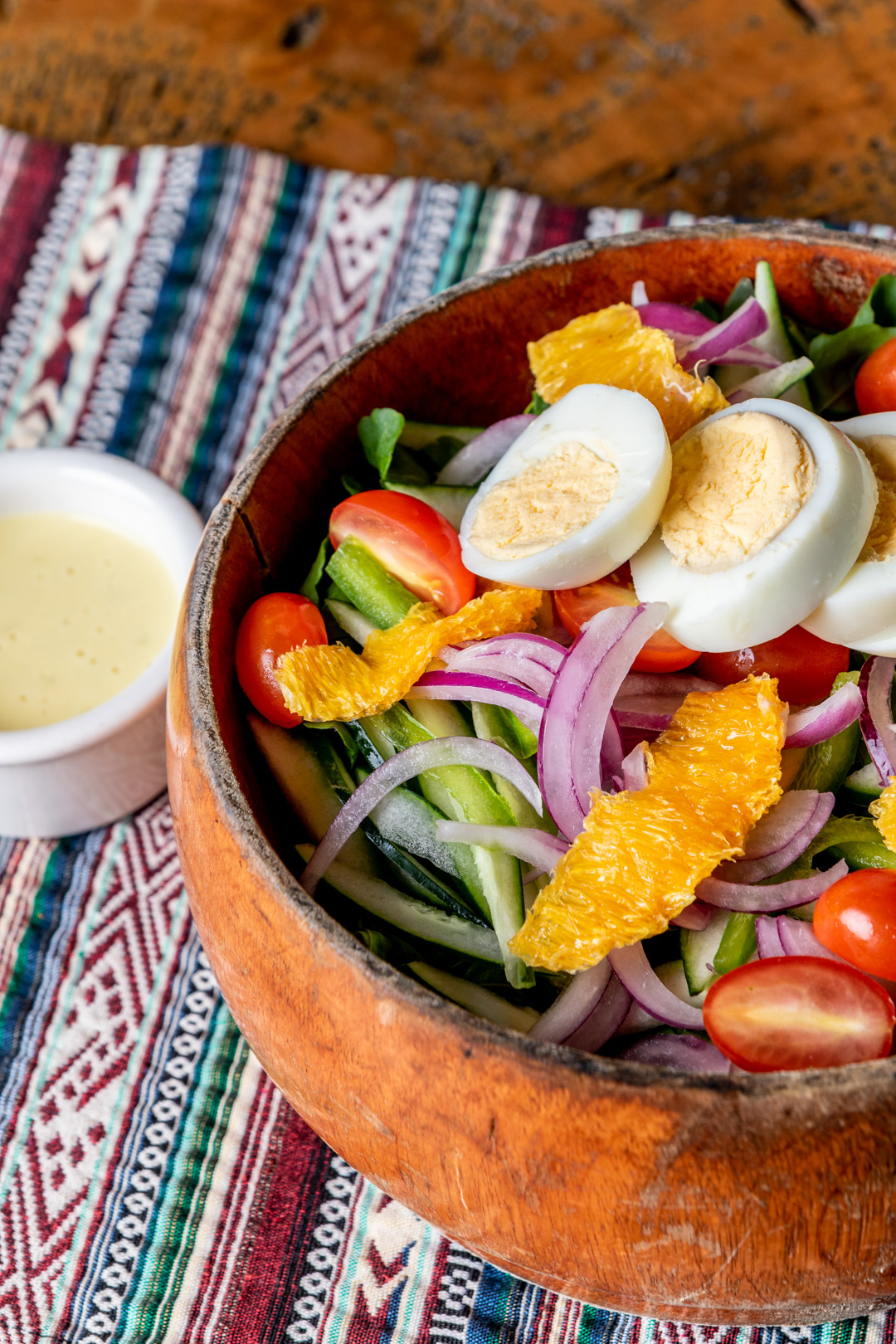 A bowl of salad with the dressing on the side at The Grove House Restaurant at The Rainforest Lodge at Sleeping Giant