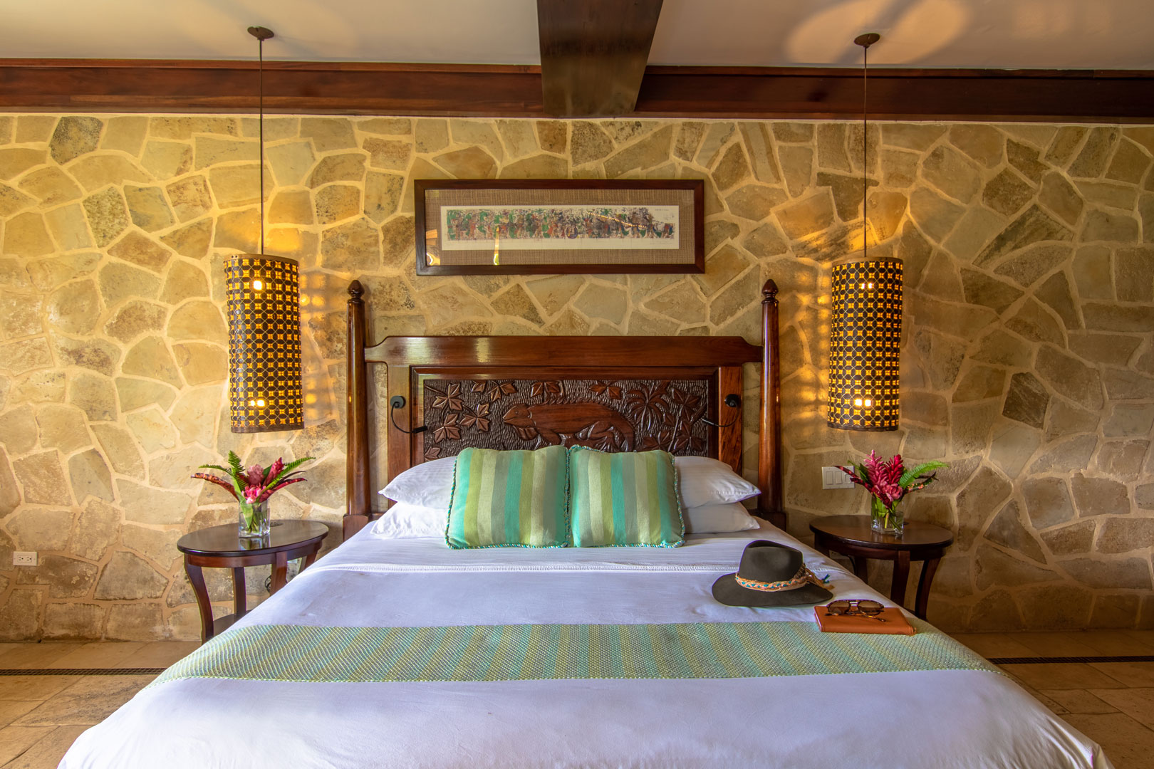 The front view of the king sized bed inside of the Mountain View Suites at The Rainforest Lodge at Sleeping Giant