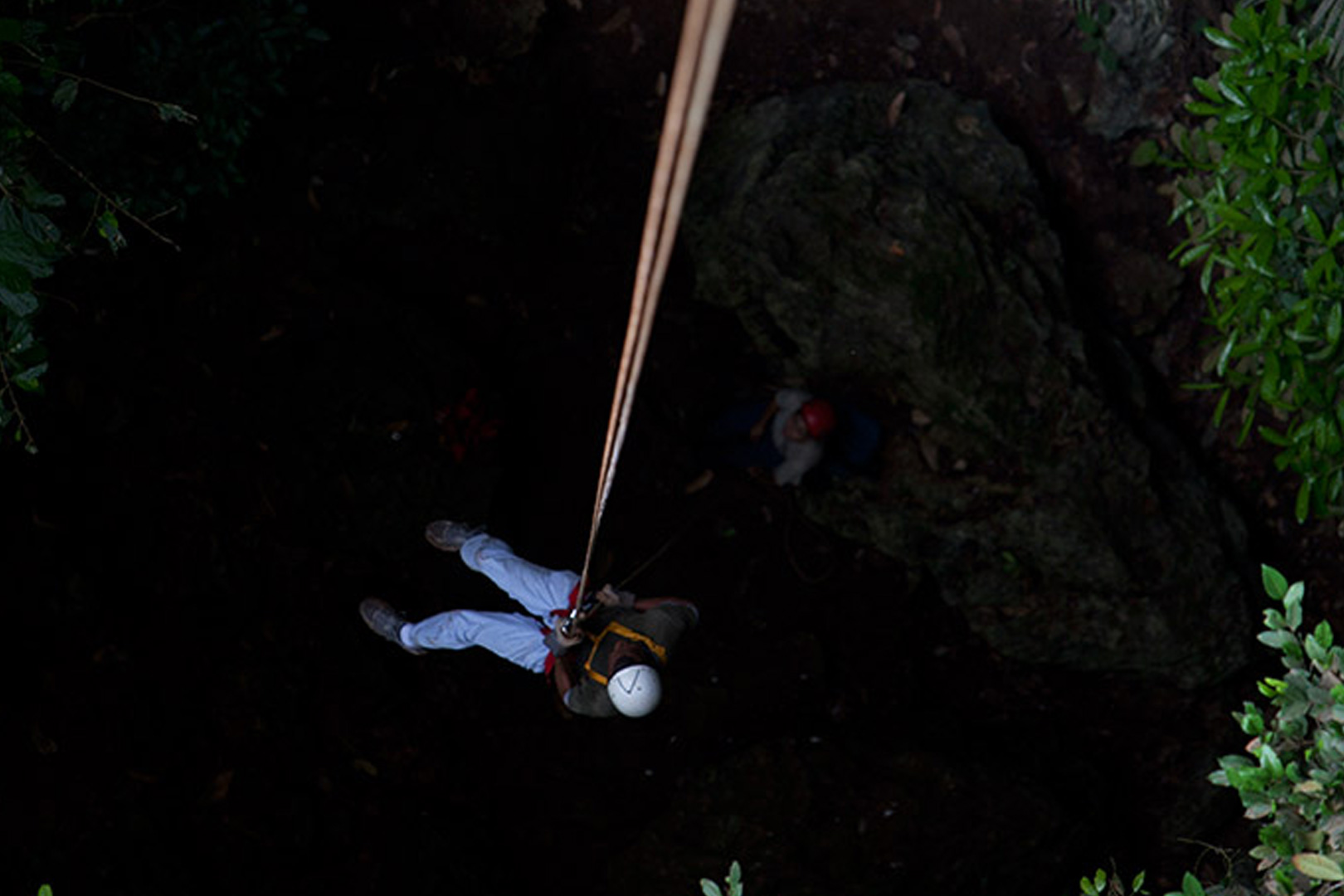 A guest reaching the bottom of the black hole during the Black Hole Drop Tour at The Rainforest Lodge at Sleeping Giant