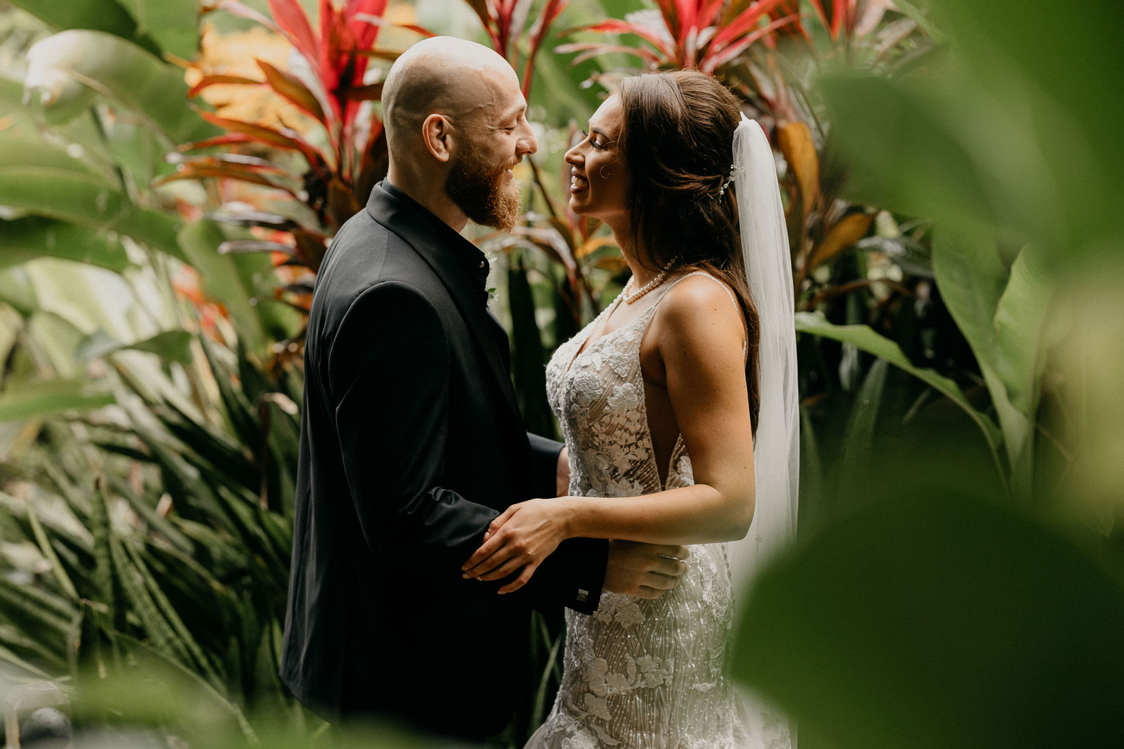 A married couple looking into each other's eyes at The Rainforest Lodge at Sleeping Giant