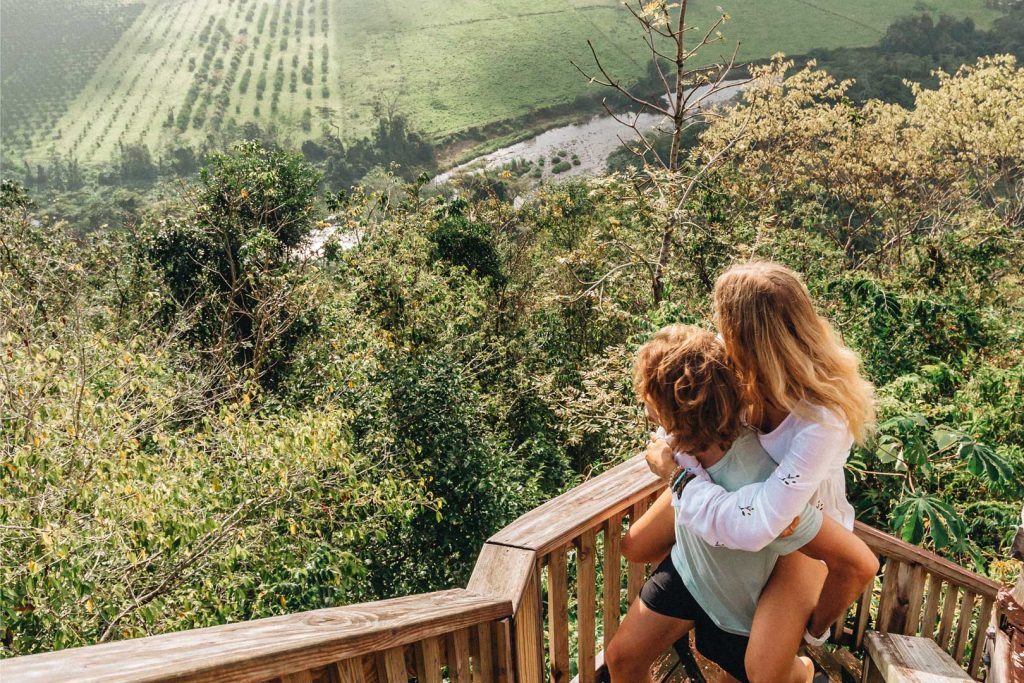 A couple walking up the steps to the Gazebo Lookout at The Rainforest Lodge at Sleeping Giant