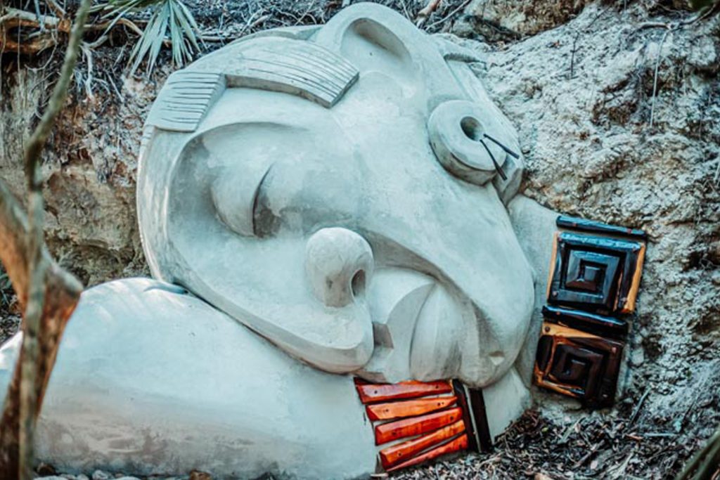 A close up view of the sleeping giant sculpture at The Rainforest Lodge at Sleeping Giant