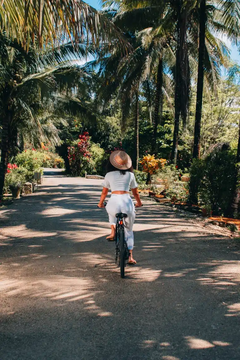 A guest riding a bike at The Rainforest Lodge at Sleeping Giant