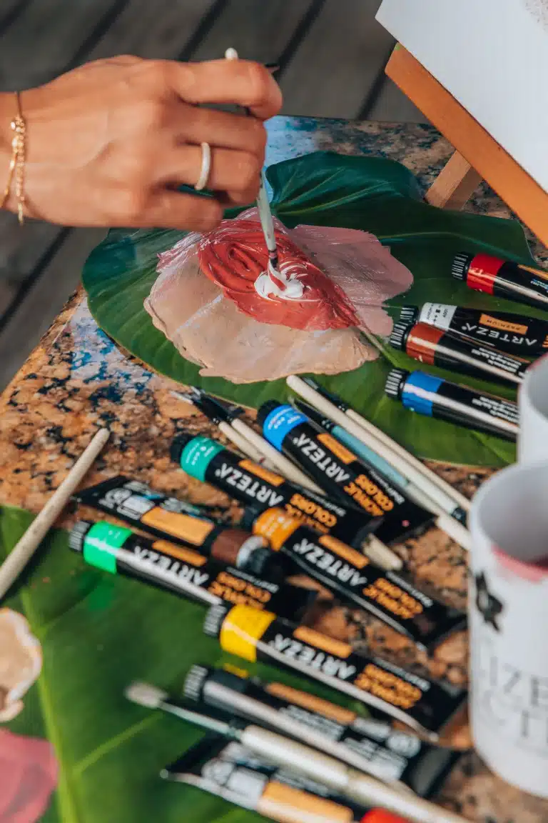 Paint mixing on a leaf at The Rainforest Lodge at Sleeping Giant