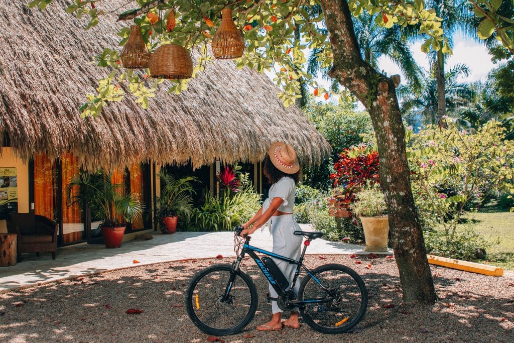 A guest using a complimentary bicycle at The Rainforest lodge at Sleeping Giant